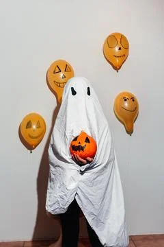 Ghost is holding a pumpkin Stock Photos