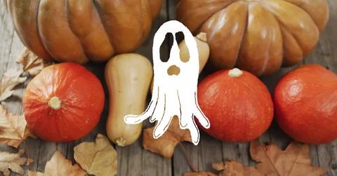 Ghost image over pumpkins and autumn leaves on wooden surface Ilustração Stock