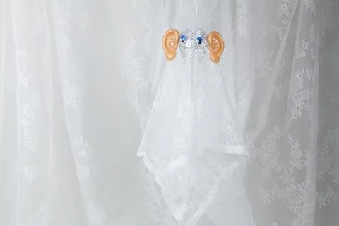 Ghost in lace curtain Stock Photos