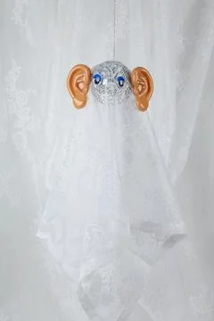 Ghost in lace curtain Stock Photos