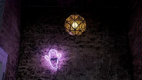 A ghost lamp hanging on a brick wall Stock Footage 126356112