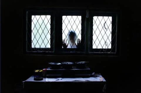 Ghost looking through Glass Window. Stock Photos