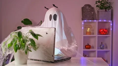 Ghost makes order from computer Halloween. Ghost pays online purchase credit Stock Footage 234166454