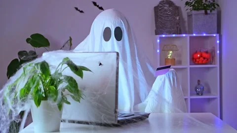 Ghost makes order from computer Halloween. Ghost pays online purchase credit Stock Footage 236922186