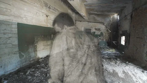 A ghost of a man appears in an abandoned old house. Stock Footage 112952151