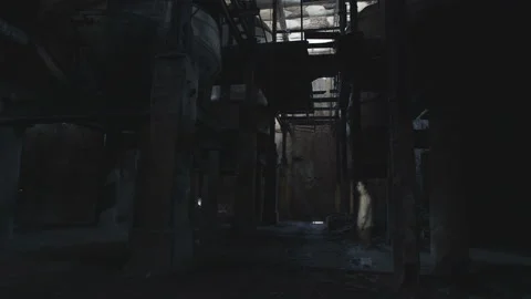 A ghost of a man wanders in the boiler room of an old factory. Stock Footage 112946408