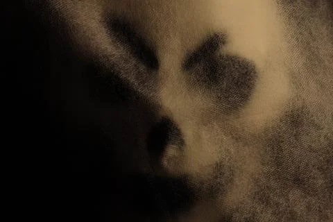 Ghost mask in the dark. Stock Photos