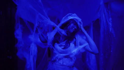 Ghost or zombie in an abandoned haunted house at night. Halloween festival Stock Footage 283365284