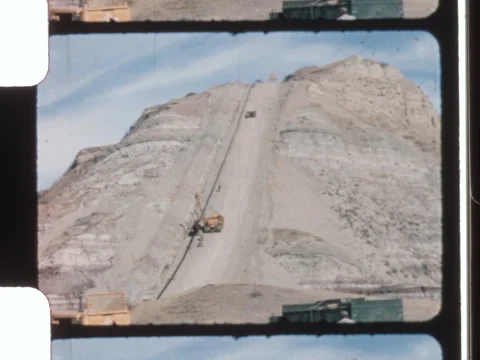 Ghost Pine, Alberta 1967 film of an oil pipeline being wrapped. 8mm 2k overscan Stock Footage 327933231