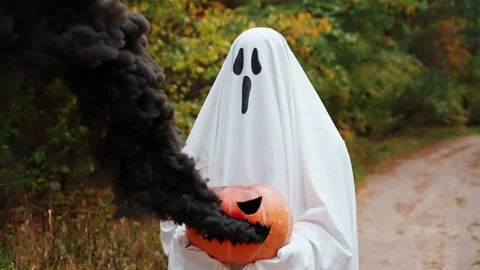 Ghost with a pumpkin in his hands with smoke, slow motion Stock Footage 252418829
