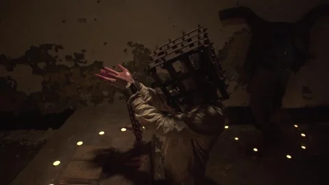 Ghost reading spells next to crucified body in basement holding human flesh. 스톡 동영상 245577565