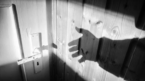 Ghost shadow hand opening door Stock Photos