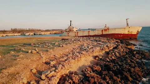 The Ghost Ship of Cyprus: Abandoned Freighter Rusts on Beach Stock Footage 173411482