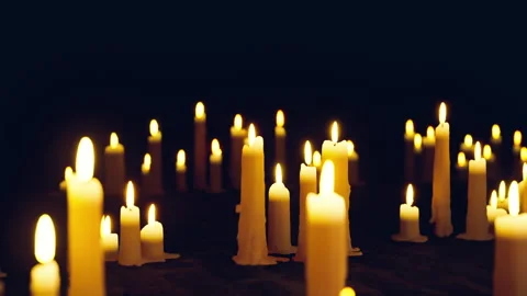 Ghostly candles flicker softly amid shadows and morning mist 스톡 동영상 331528983