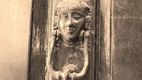 Ghostly sepia image of door knocker covered in cobwebs Stock Footage 273510545