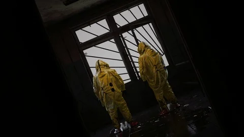 Ghostly Soviet building with hazmat characters in dialogue Vídeos de archivo 127067410