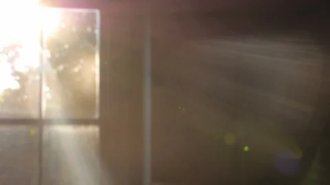 Ghostly sun shines through window of a dark, haunted house Stock Footage 100476281