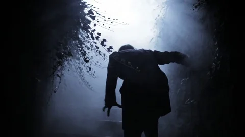 Ghostly, undead Man walks through smoky, haunted Cemetery Stock Footage 81283300