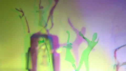 Ghosts of Light: Silhouettes and Prismatic Glow Stock Footage 302412412