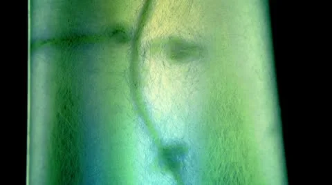 Giant beaker CU 3 colored Stock Footage 10584776