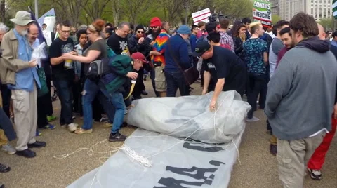 Giant blunt rolled out at pro-marijuana rally in Washington, D.C. Stock Footage 61840186