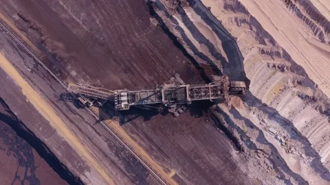 Giant bucket wheel excavator mining coal in open pit mine Stock Footage 342813623