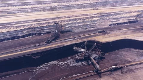 Giant bucket wheel excavator mining coal in an opencast pit 動画素材 342813629