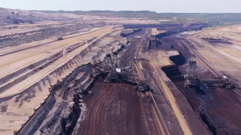 Giant bucket wheel excavator mining coal in open pit mine Stock Footage 345026909