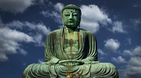 Giant Buddha Statue Sitting with Clouds in Timelapse in the Background Stock Footage 58120090