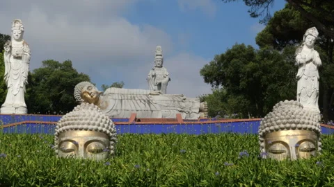 Giant Buddha Statues Surrounded by Greenery at Eden Garden, Portugal Видео 336956663