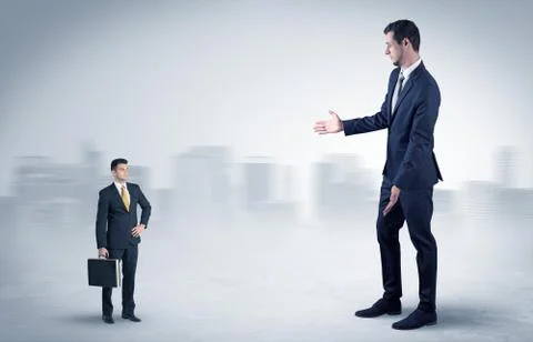 Giant businessman is  afraid of small executor Stock Photos