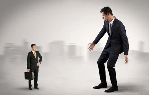 Giant businessman is  afraid of small executor Stock Photos