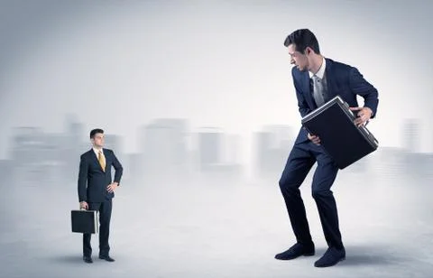 Giant businessman is  afraid of small executor Stock Photos