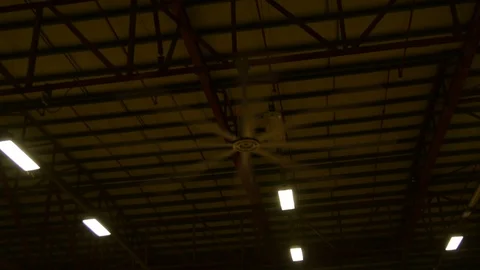 Giant ceiling ventilator in low light of evening  Vidéo 109404583