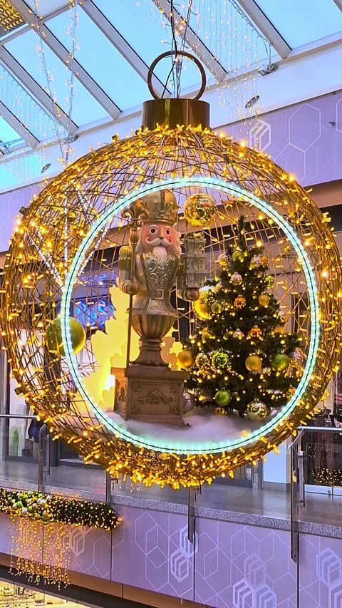 Giant Christmas ball with Nutcracker and tree in shopping mall Stock Footage 295688217