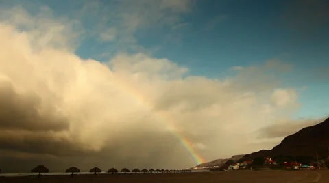 Giant Clouds Over Beach With A Rainbow HD Video Stock Footage 28924047