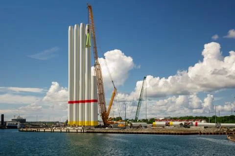 Giant Crawler Crane Assembling Wind Turbine Tower Sections at Port Harbor, .. Stock Photos