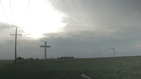 A giant cross rises from the ground next to the interstate in Groom, TX Stock Footage 65055065