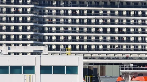 Giant cruise ship with countless cabins and balconies sailing across the fr.. Stock Footage 329660045