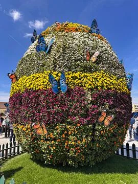 Giant Easter Egg Floral Installation Decorated with Butterflies Stock Photos
