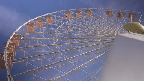 Giant ferris wheel operating on perfect day Stock Footage