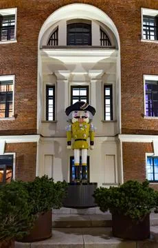 Giant festive nutcracker statues decorating a historic courtyard Stock Photos
