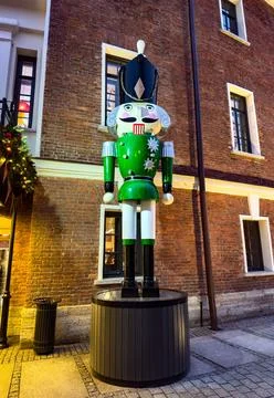Giant festive nutcracker statues decorating a historic courtyard Stock Photos