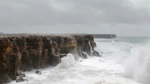Giant Hercules waves break over the shore in Sagres. Costa Visentina. Stock Footage 95207966