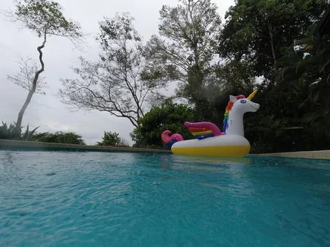 Giant Inflatable Unicorn Pool Float Floatie Ride Stock Photos