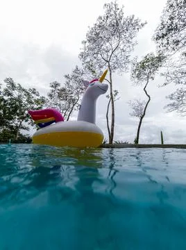 Giant Inflatable Unicorn Pool Float Floatie Ride Stock Photos
