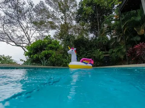 Giant Inflatable Unicorn Pool Float Floatie Ride Stock Photos