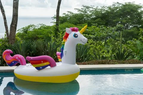 Giant Inflatable Unicorn Pool Float Floatie Ride Stock Photos