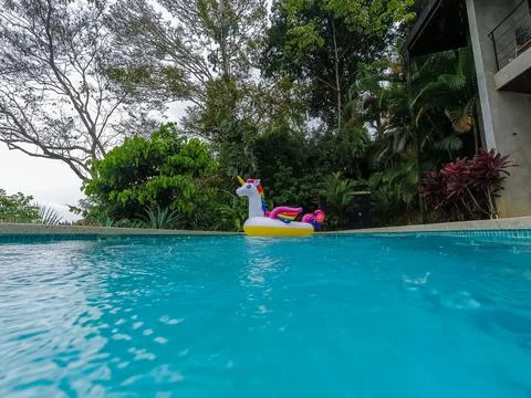 Giant Inflatable Unicorn Pool Float Floatie Ride Stock Photos