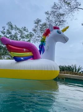 Giant Inflatable Unicorn Pool Float Floatie Ride Stock Photos